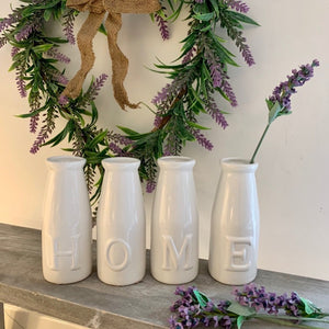 Set of Four HOME Bottles Which Spell The Word HOME