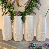 Set of Four White HOME Bottles