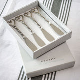 Set of Four Twisted Nickel Heart Butter Knives